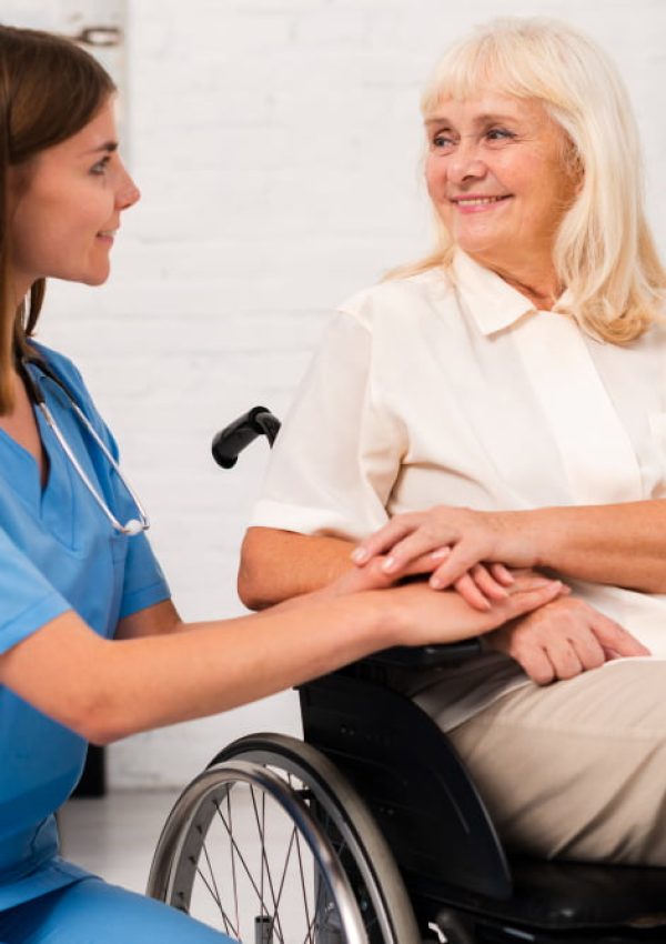 caregiver-taking-care-woman-wheelchair